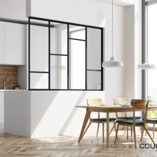 Modern kitchen interior with white and wooden walls, a wooden floor and white countertops. A long table with chairs near it. A side view. 3d rendering mock up